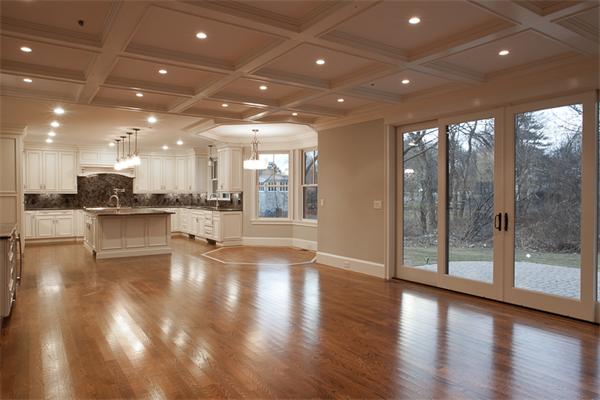 56 Broken Tree Road Newton, MA 02459 - Photo 5 of 30 a view of an empty room with wooden floor and a kitchen