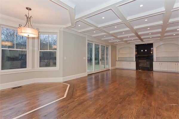 56 Broken Tree Road Newton, MA 02459 - Photo 9 of 30 a view of empty room with wooden floor and windows