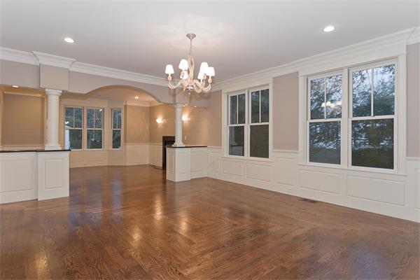 56 Broken Tree Road Newton, MA 02459 - Photo 10 of 30 a view of an empty room with wooden floor and a window