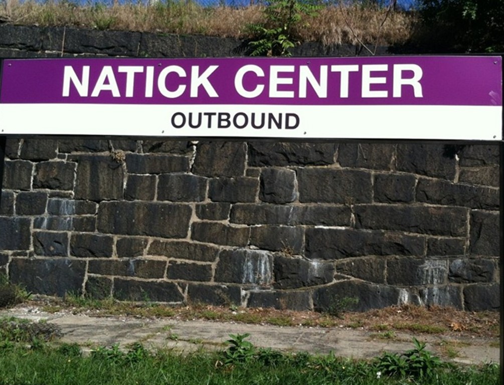15 Church Street, Unit 2 Natick, MA 01760 - Photo 14 of 14 a street sign that is sitting on a brick wall
