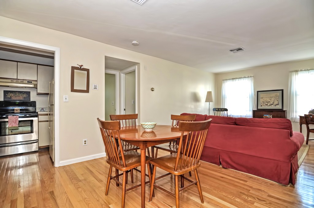 15 Church Street, Unit 2 Natick, MA 01760 - Photo 2 of 14 a dining room with furniture and wooden floor