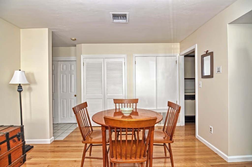 15 Church Street, Unit 2 Natick, MA 01760 - Photo 5 of 14 a view of a dining room with furniture and wooden floor