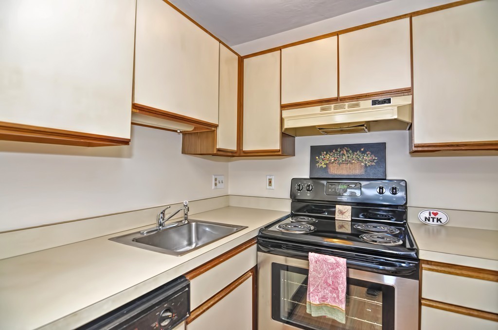15 Church Street, Unit 2 Natick, MA 01760 - Photo 7 of 14 a kitchen with a stove and a sink