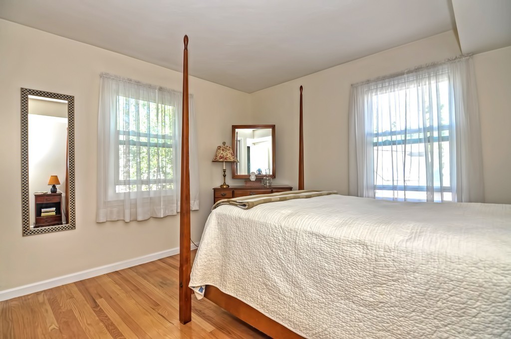 15 Church Street, Unit 2 Natick, MA 01760 - Photo 9 of 14 a bed sitting in a spacious bedroom next to a window