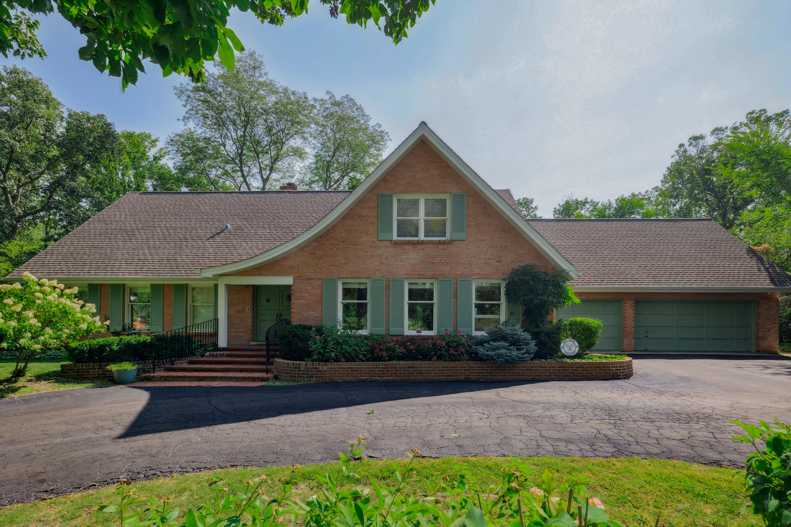 7 Old Hunt Road Northfield, IL 60093 - Photo 2 of 5 a front view of a house with a garden