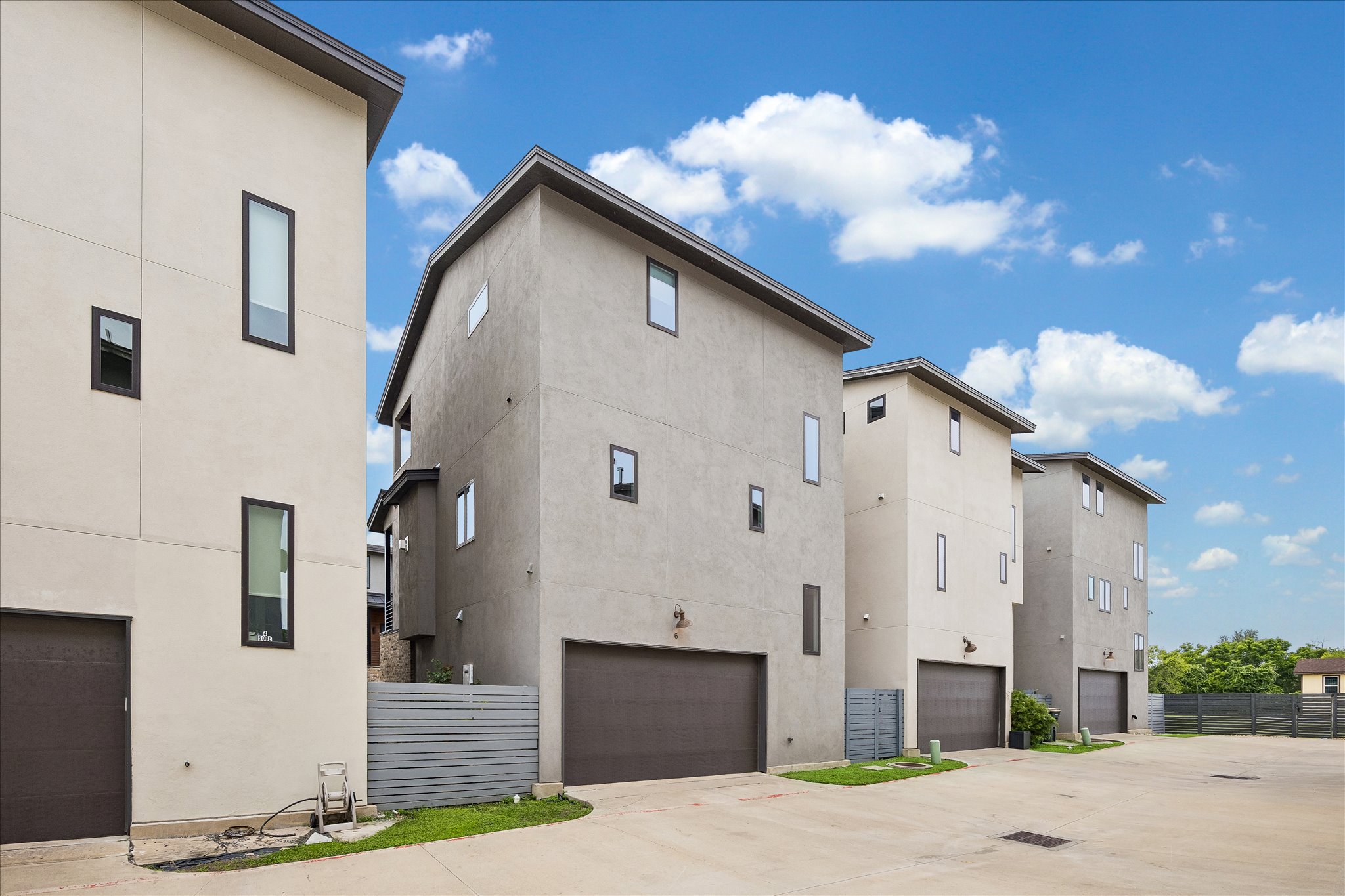 5006 Pecan Springs Road, Unit 6 Austin, TX 78723 - Photo 30 of 30 Clean lines and a modern facade define these urban dwellings, offering sleek curb appeal.