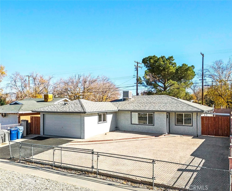 a front view of a house with a garage