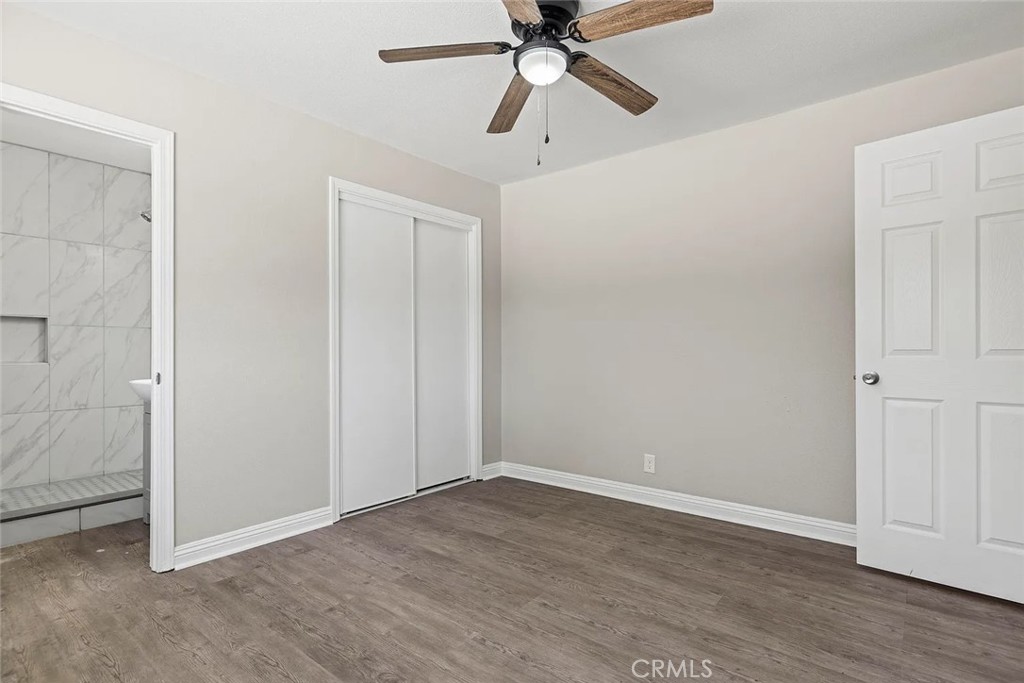 44532 Andale Avenue Lancaster, CA 93535 - Photo 11 of 21 a view of an empty room with wooden floor