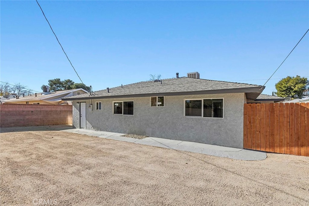 44532 Andale Avenue Lancaster, CA 93535 - Photo 19 of 21 a front view of a house with a yard