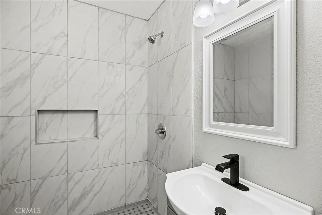 44532 Andale Avenue Lancaster, CA 93535 - Photo 7 of 21 a bathroom with a sink and mirror