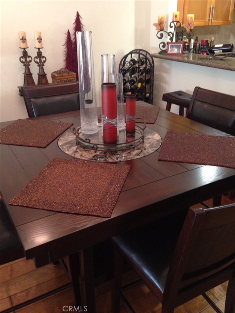 8238 West Manchester Avenue, Unit 109 Playa del Rey, CA 90293 - Photo 2 of 5 a dining room with furniture and a floor to ceiling window