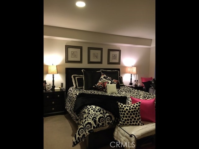 8238 West Manchester Avenue, Unit 109 Playa del Rey, CA 90293 - Photo 4 of 5 a bedroom with a bed and wooden floor