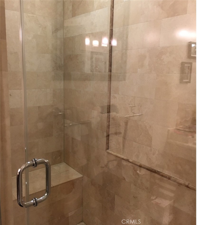 8238 West Manchester Avenue, Unit 109 Playa del Rey, CA 90293 - Photo 5 of 5 a bathroom with a granite countertop shower