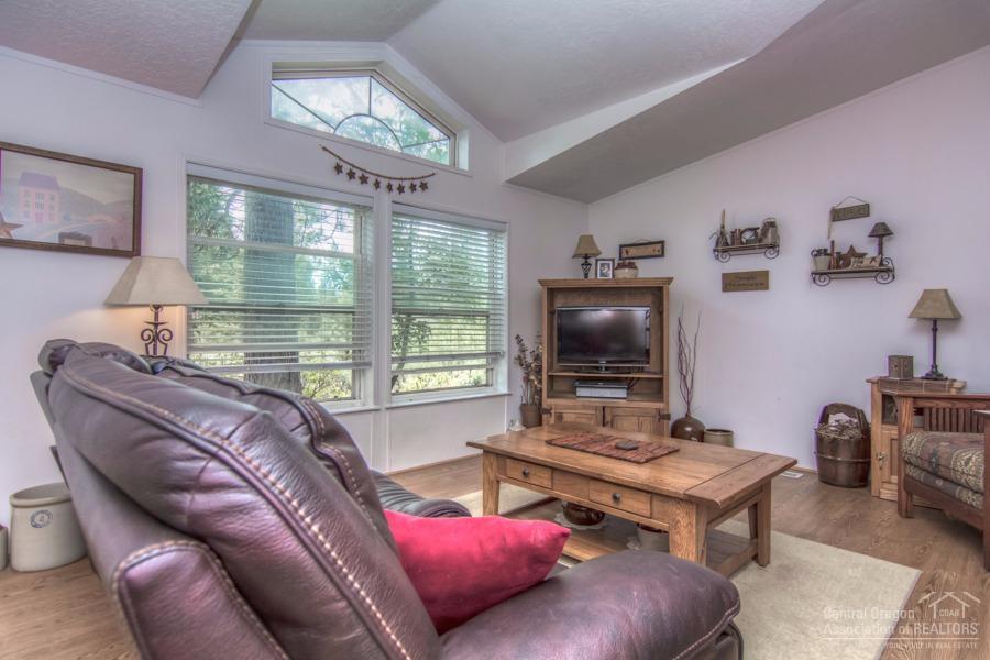 60041 Hopi Road Bend, OR 97702 - Photo 6 of 19 a living room with furniture and a flat screen tv