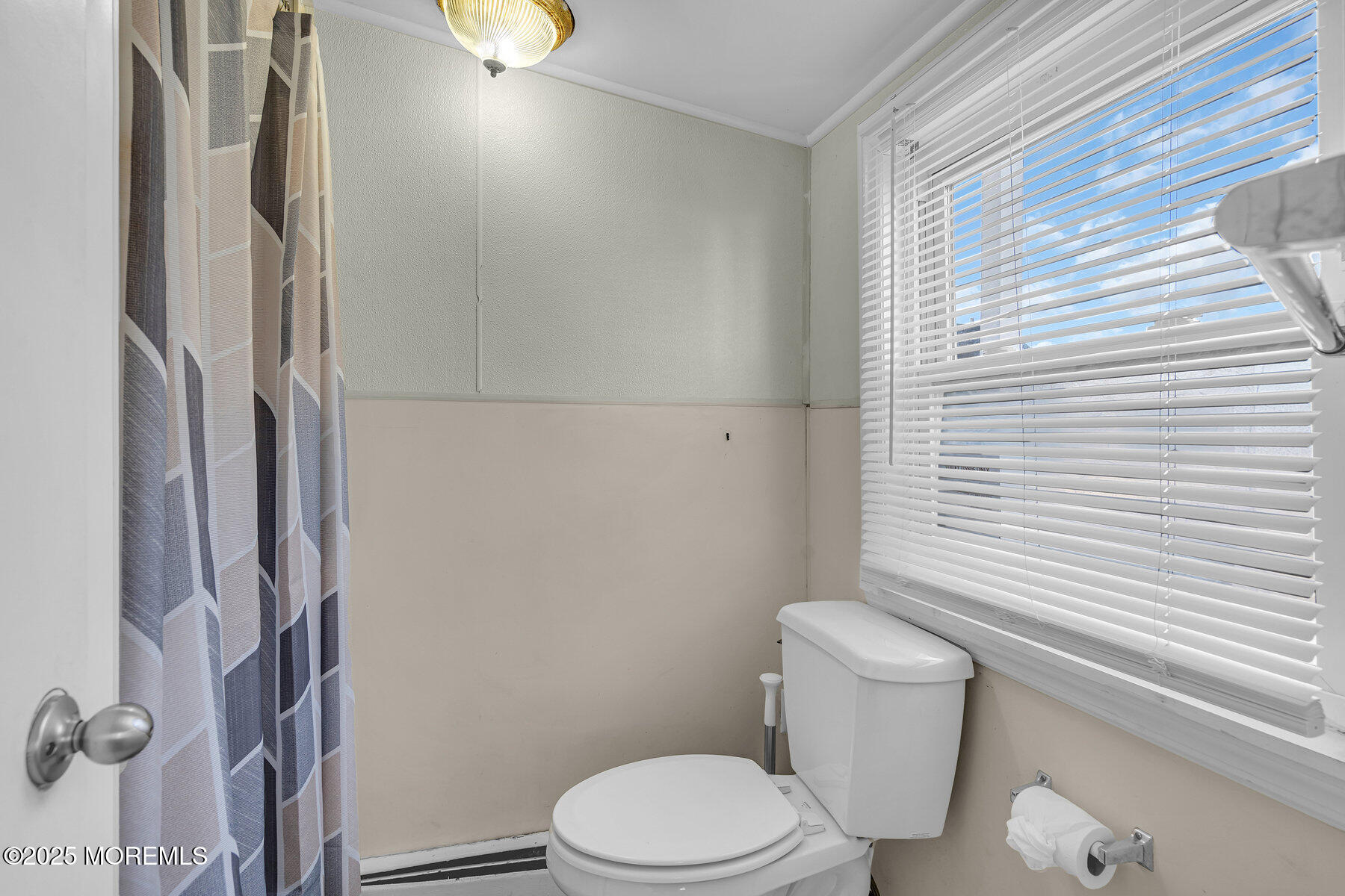 549 Brielle Road Manasquan, NJ 08736 - Photo 12 of 17 a white toilet sitting next to a bathroom sink