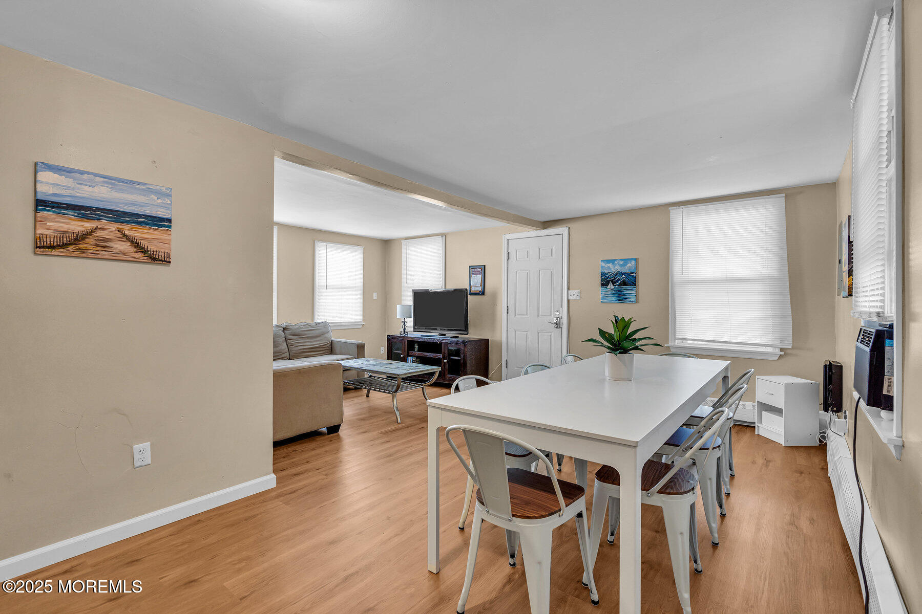 549 Brielle Road Manasquan, NJ 08736 - Photo 3 of 17 a view of a dining room with furniture and wooden floor