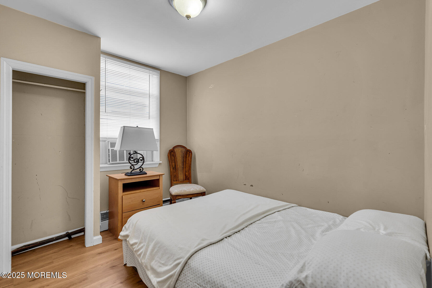 549 Brielle Road Manasquan, NJ 08736 - Photo 6 of 17 a bedroom with a bed and a table in it
