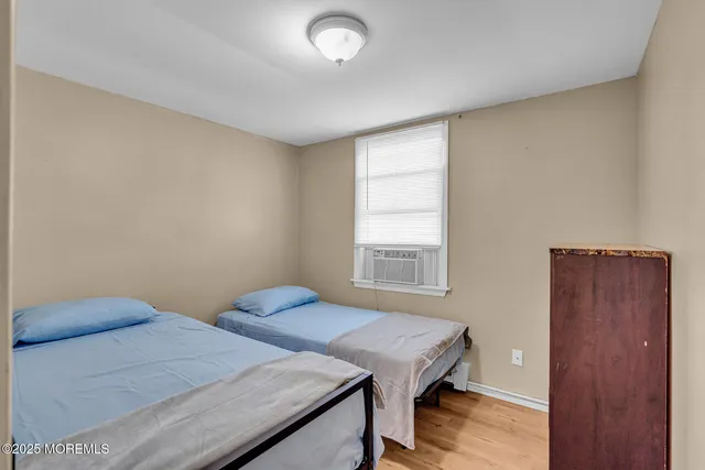 a bedroom with bed and a window