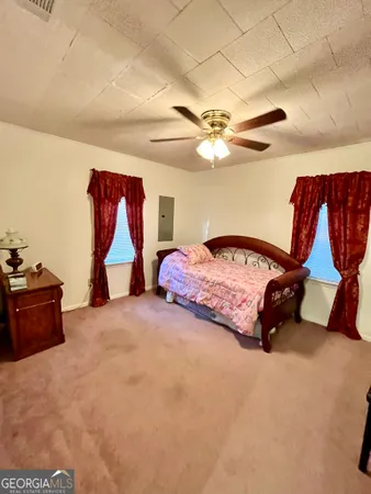 a bedroom with furniture and a chandelier