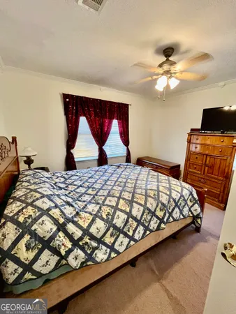 a bedroom with a bed and furniture