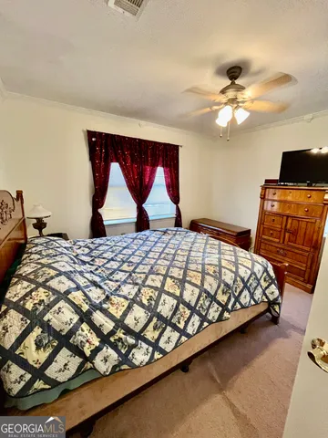 a bedroom with a bed and furniture