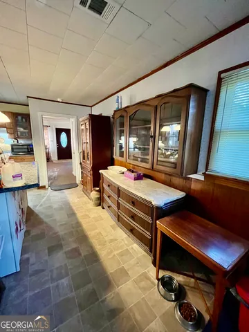 a living room with furniture and flat screen tv
