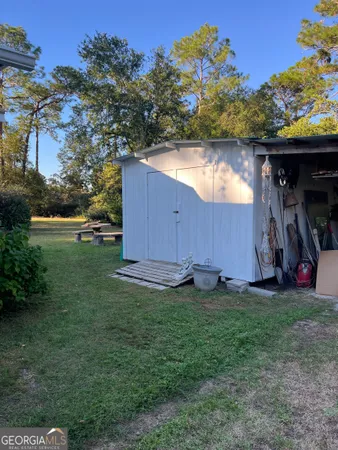 a backyard of a house with lots of green space