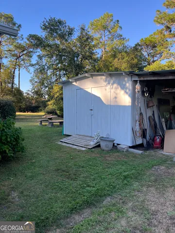a backyard of a house with lots of green space