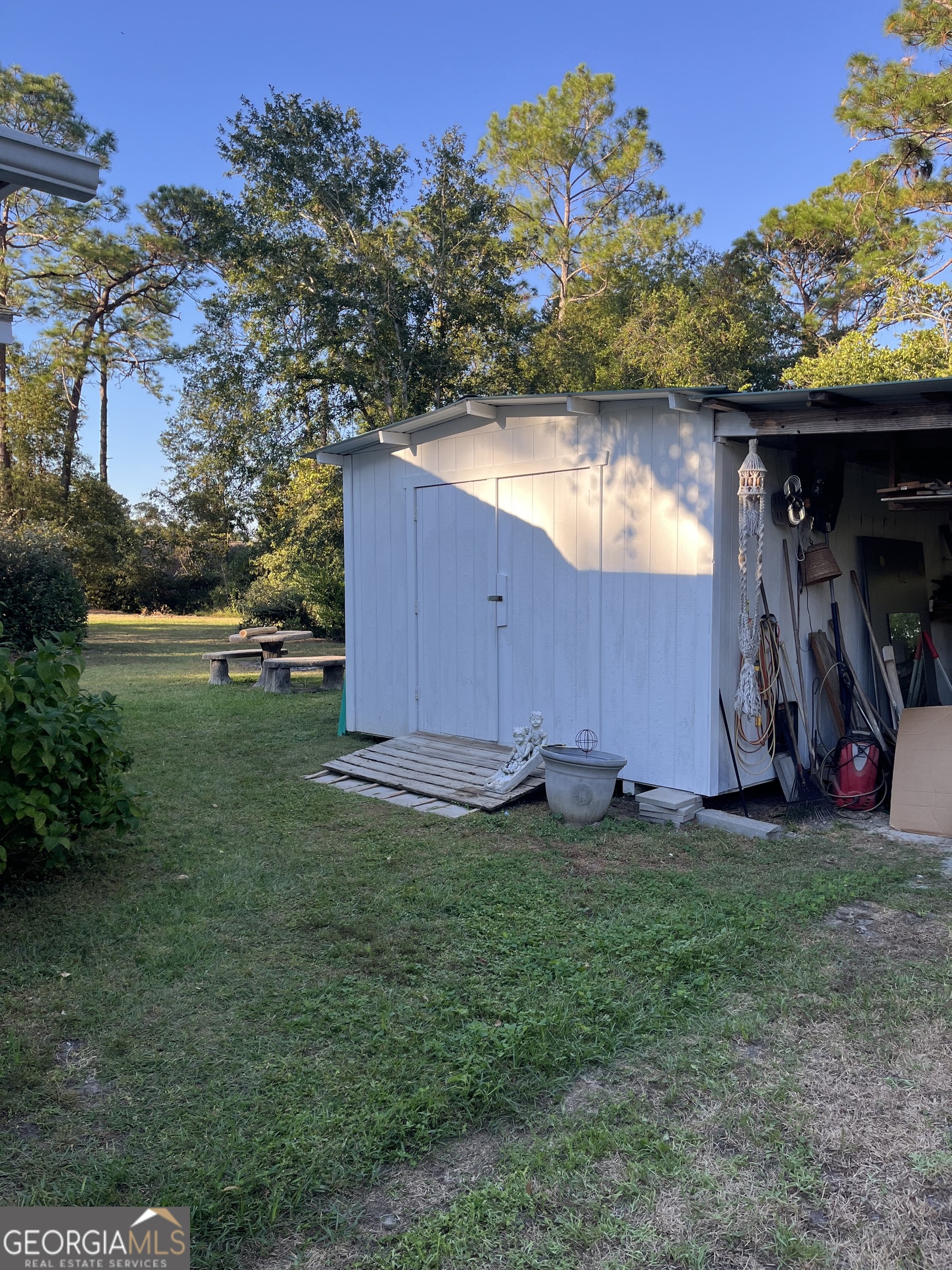 404 Community Drive Waycross, GA 31501 - Photo 5 of 24 a backyard of a house with lots of green space