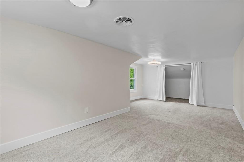 234 Navajo Road Pittsburgh, PA 15241 - Photo 23 of 34 Bedroom 2 is expansive, running the full depth of the house.