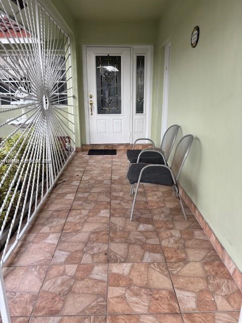 5852 Southwest 147th Place Miami, FL 33193 - Photo 1 of 11 a view of a entryway door with wooden floor