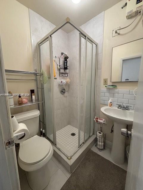 5852 Southwest 147th Place Miami, FL 33193 - Photo 5 of 11 a bathroom with a sink toilet and shower