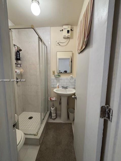 5852 Southwest 147th Place Miami, FL 33193 - Photo 6 of 11 a bathroom with a sink toilet and shower