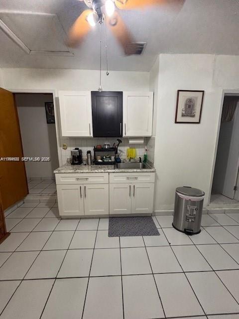 5852 Southwest 147th Place Miami, FL 33193 - Photo 7 of 11 a kitchen with a sink and a stove