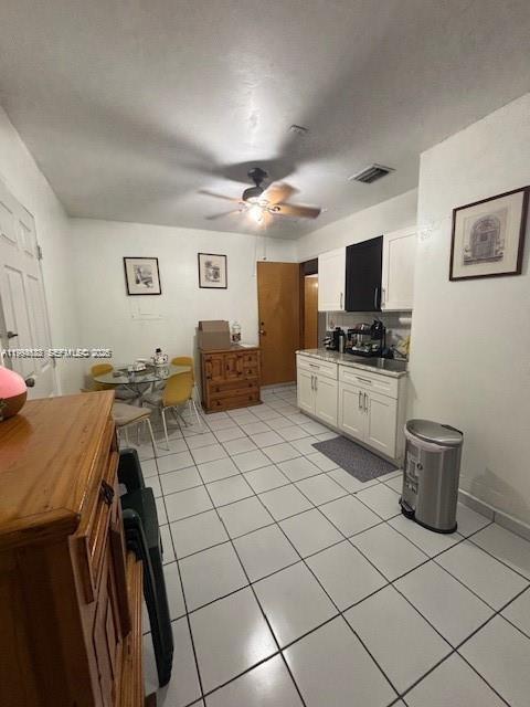 5852 Southwest 147th Place Miami, FL 33193 - Photo 9 of 11 a living room with furniture a flat screen tv and kitchen view