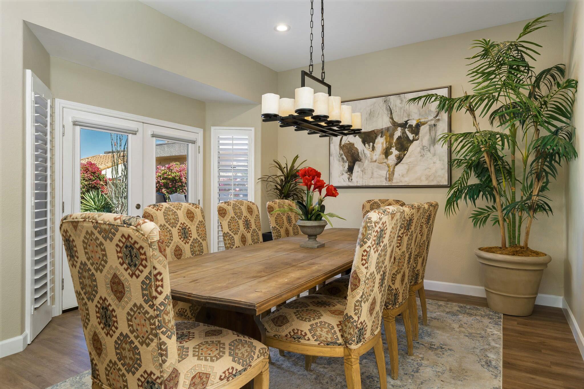 33 Colonial Drive Rancho Mirage, CA 92270 - Photo 17 of 62 a view of a dining room with furniture and a chandelier
