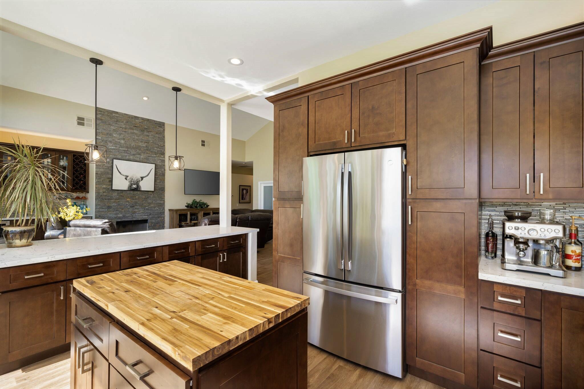33 Colonial Drive Rancho Mirage, CA 92270 - Photo 24 of 62 a kitchen with stainless steel appliances granite countertop a refrigerator and a stove top oven