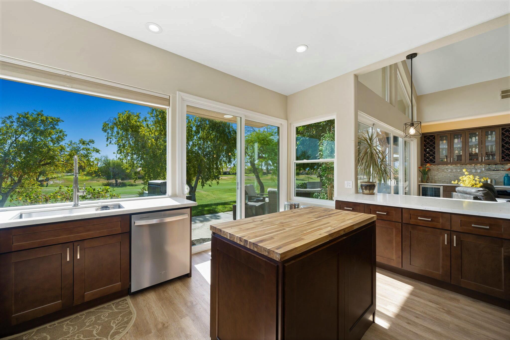 33 Colonial Drive Rancho Mirage, CA 92270 - Photo 25 of 62 a kitchen with a sink and wooden floor