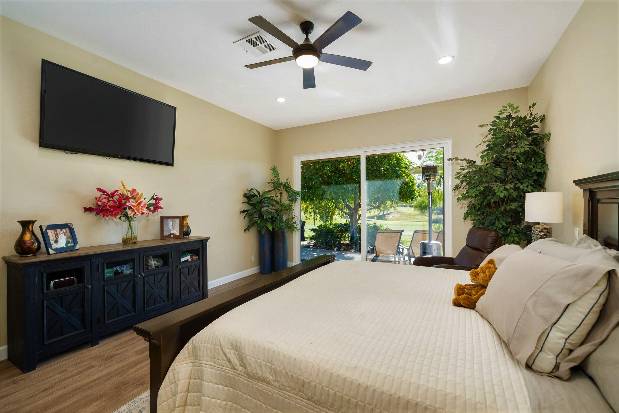 33 Colonial Drive Rancho Mirage, CA 92270 - Photo 27 of 62 a bedroom with a bed and a flat screen tv