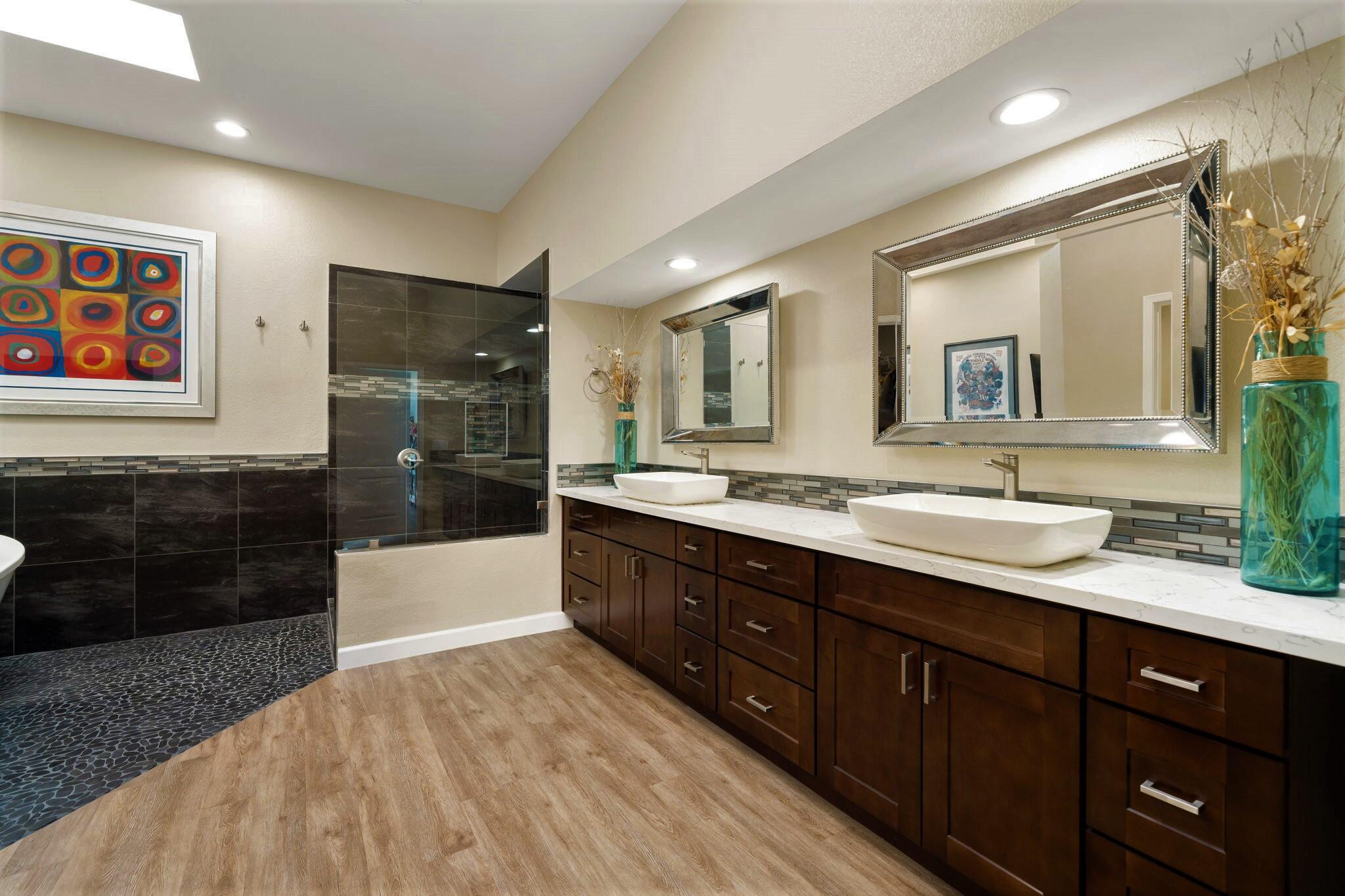 33 Colonial Drive Rancho Mirage, CA 92270 - Photo 28 of 62 a spacious bathroom with a granite countertop double vanity sink a mirror and a bathtub