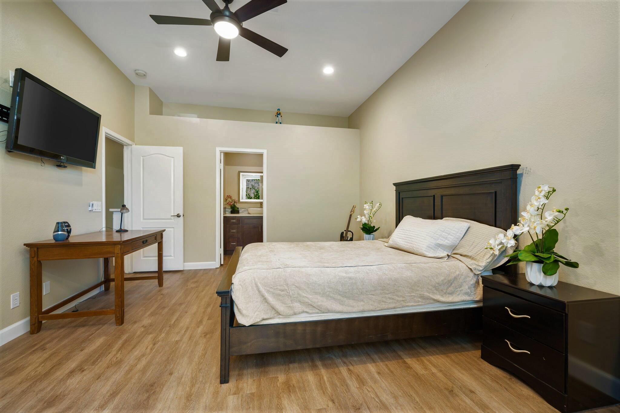 33 Colonial Drive Rancho Mirage, CA 92270 - Photo 32 of 62 a bedroom with a bed and a flat screen tv