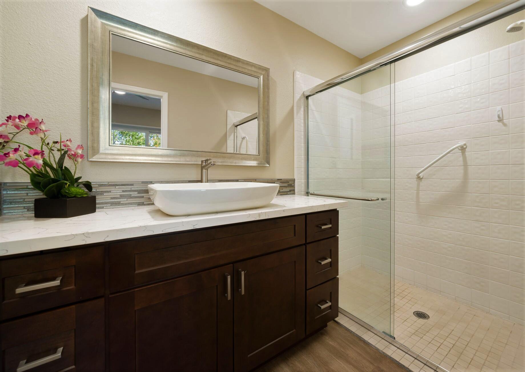 33 Colonial Drive Rancho Mirage, CA 92270 - Photo 34 of 62 a bathroom with a double vanity sink mirror and shower