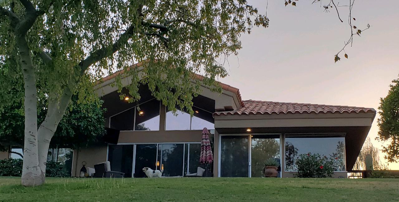 33 Colonial Drive Rancho Mirage, CA 92270 - Photo 45 of 62 a view of a large building with a big yard and large trees