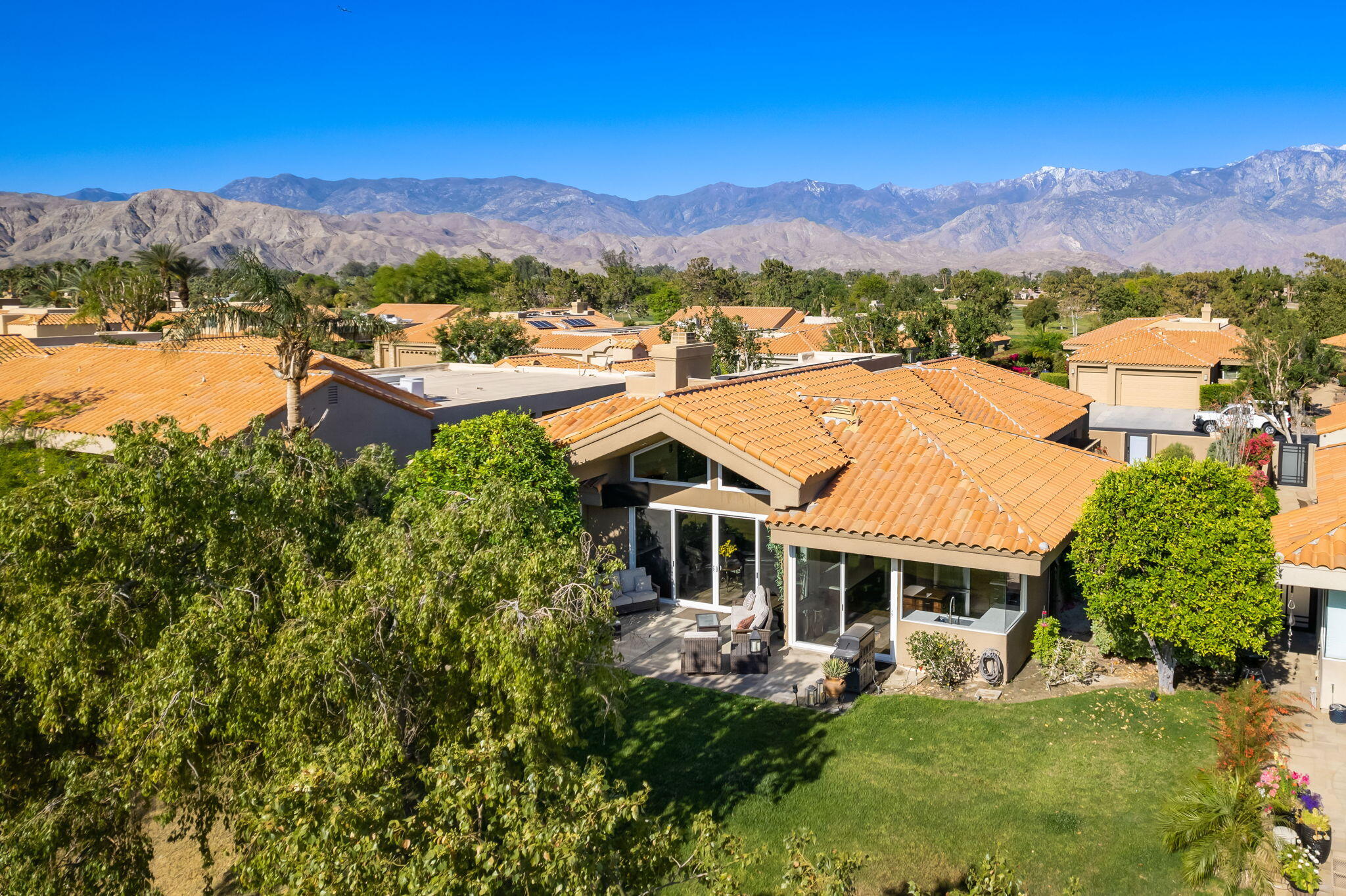 33 Colonial Drive Rancho Mirage, CA 92270 - Photo 55 of 62 a view of a house with a yard and a mountain