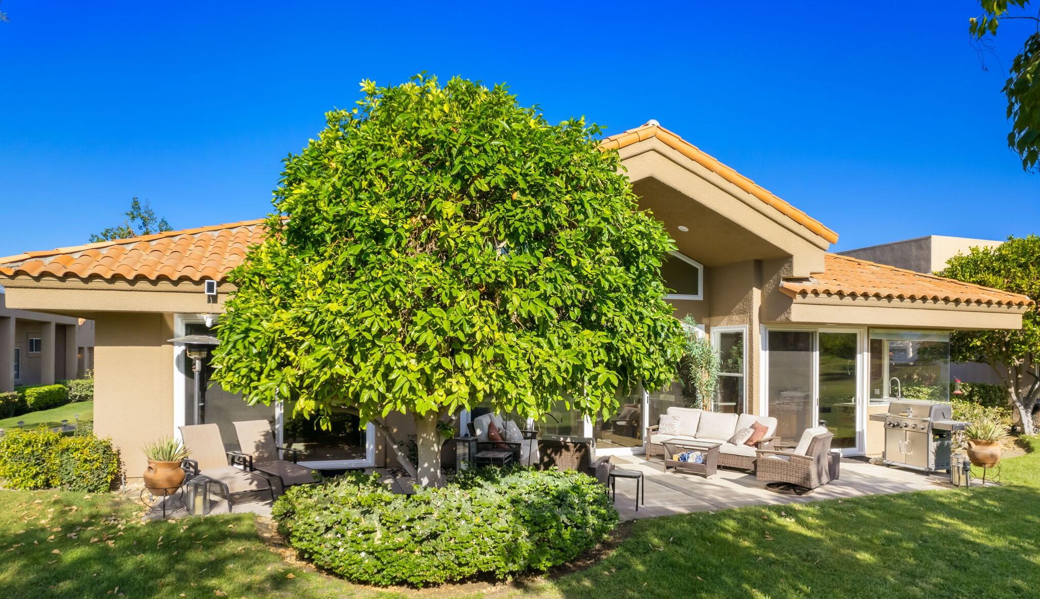 33 Colonial Drive Rancho Mirage, CA 92270 - Photo 56 of 62 a front view of a house with garden