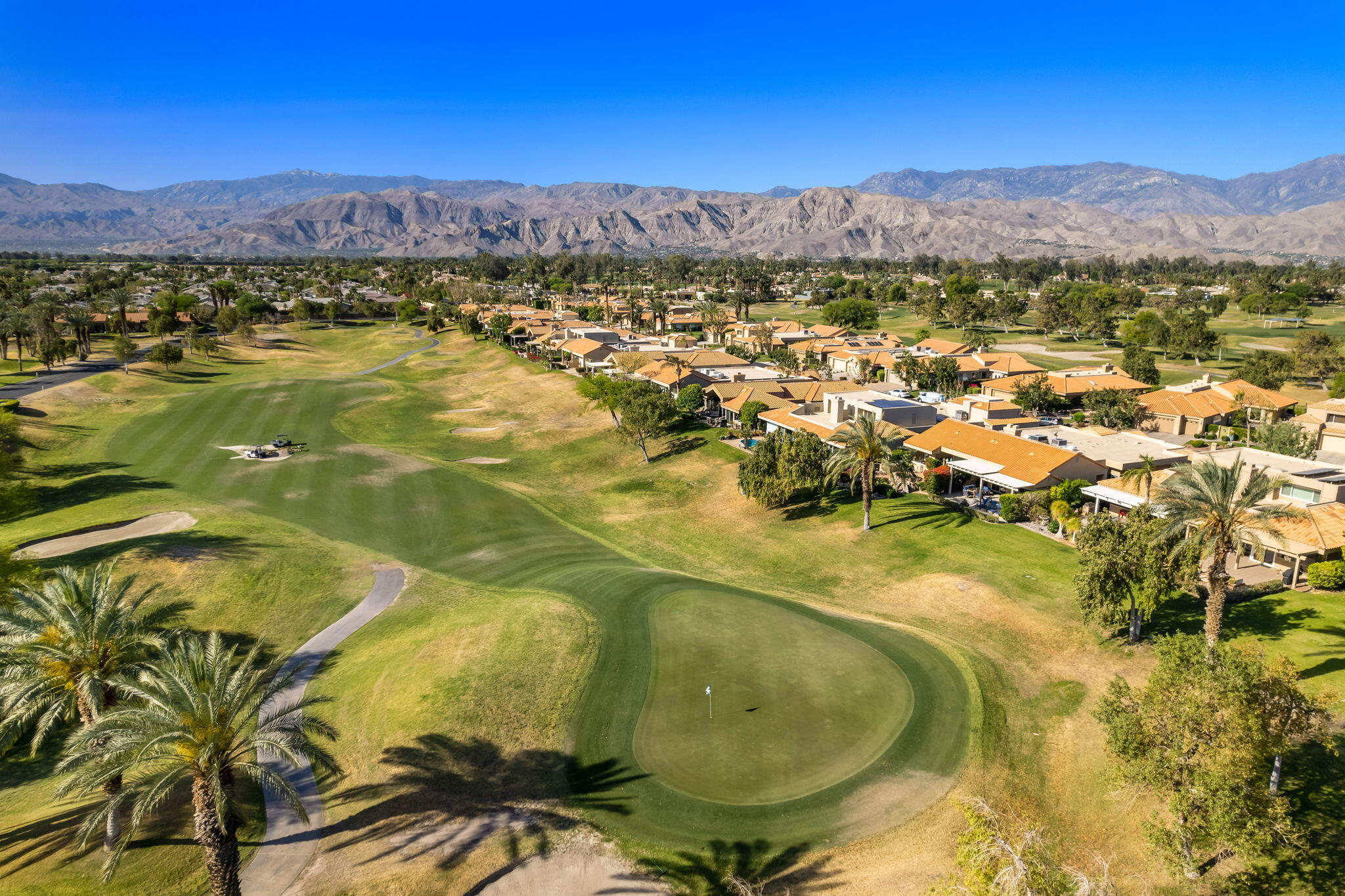 33 Colonial Drive Rancho Mirage, CA 92270 - Photo 62 of 62 a view of a swimming pool with a lake view