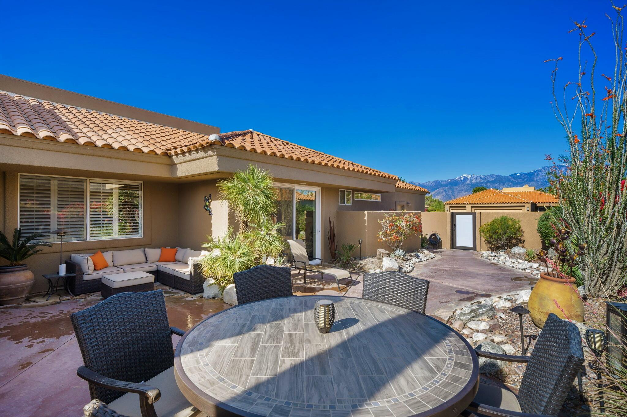 33 Colonial Drive Rancho Mirage, CA 92270 - Photo 7 of 62 a view of a house with swimming pool and sitting area