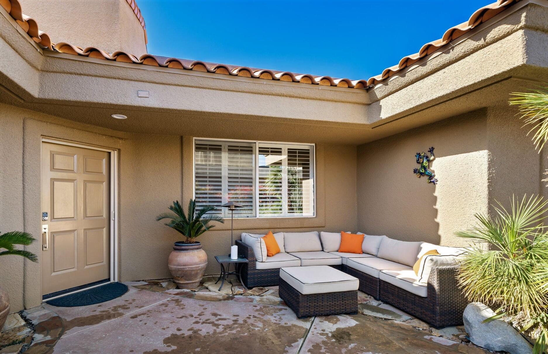 33 Colonial Drive Rancho Mirage, CA 92270 - Photo 8 of 62 a view of a livingroom with furniture and a couch