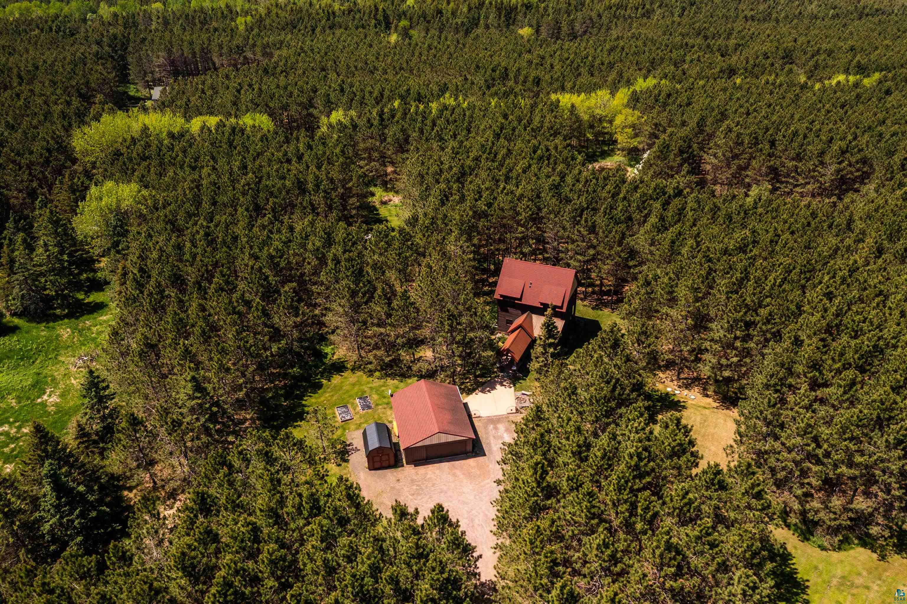 75 East Stark Road Esko, MN 55733 - Photo 84 of 87 Aerial perspective showcasing a property surrounded by dense evergreen trees