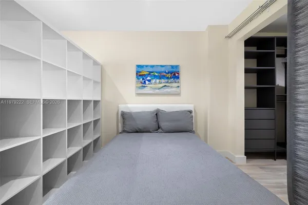 a living room with closet and cabinet